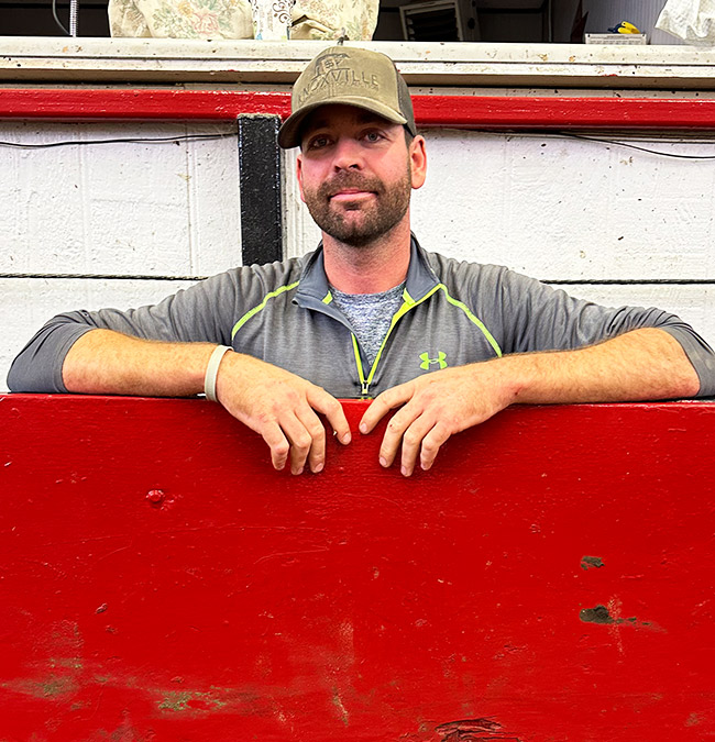 Staff Member Corey Moore with Knoxville Regional Livestock Auction