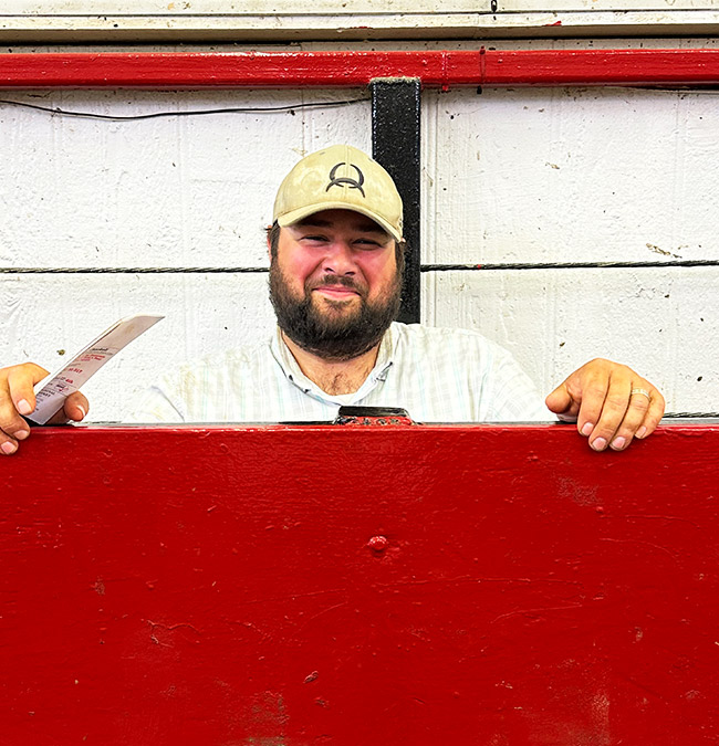 Staff Member Garrett Hollinrake with Knoxville Regional Livestock Auction